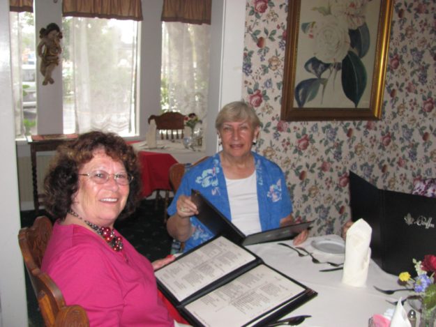 322096_10150381642817964_241315306_o two women looking at menus