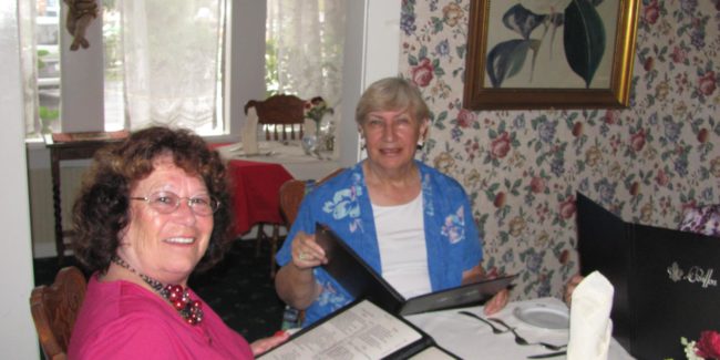 two women looking at menus