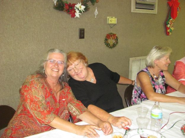 387517_10150495270962964_1165186240_n two women sitting at a table