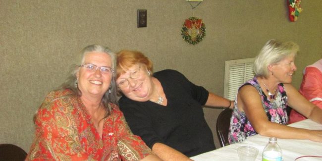 two women sitting at a table