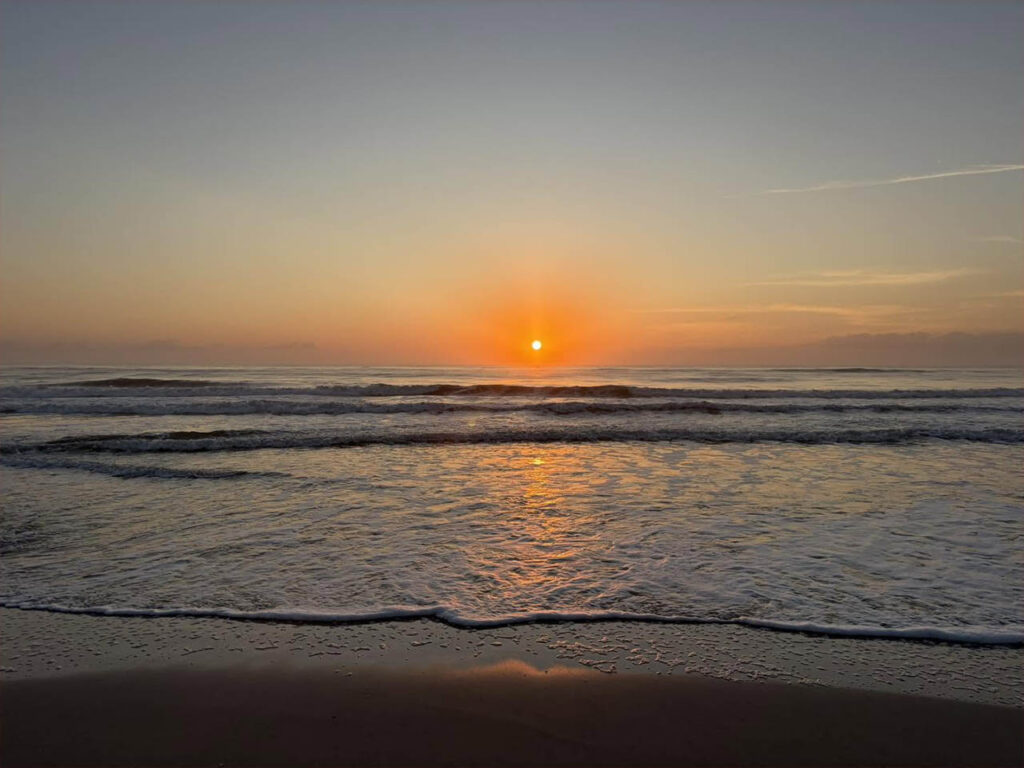 Sunrise over the Atlantic Ocean viewed from the beach near North Beach Camp Resort in St. Augustine, Florida.