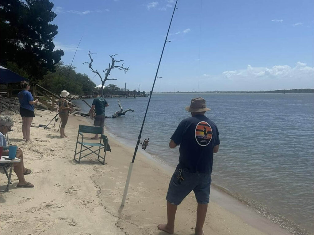 Campers fishing along the Intracoastal Waterway at North Beach Camp Resort in St. Augustine, Florida.